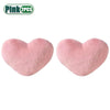 Two pink heart-shaped plush cushions displayed side by side.