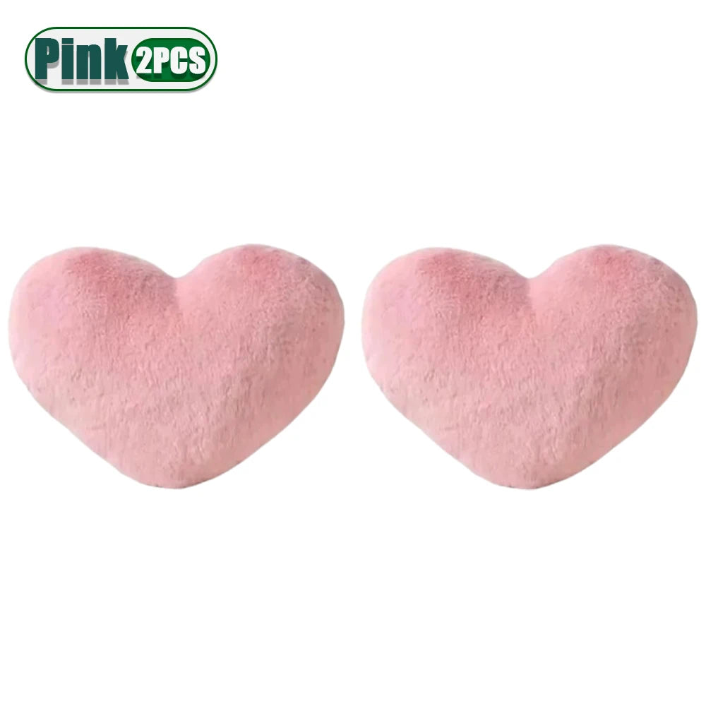 Two pink heart-shaped plush cushions displayed side by side.