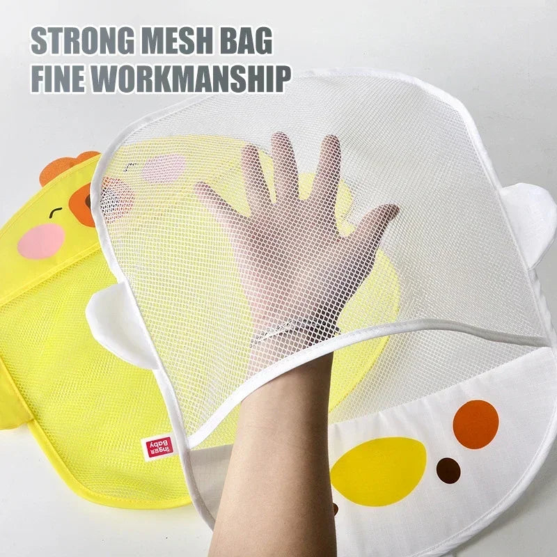 A white mesh bag for a toddler bath toy organizer, showing a hand reaching through the fine mesh net.