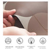 A hand is pressing a leaf-shaped bathroom mat with a rubber backing, showing its soft and anti-slip design.