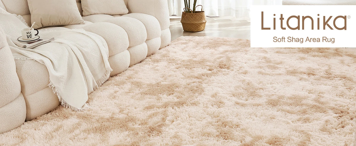 A light beige shaggy area rug in a soft plush texture placed on a light wooden floor.