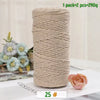 A roll of beige medium-thick hand-woven cotton yarn for crafting with a single rose visible nearby.