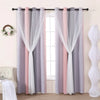 Grey and pink gradient star perforated curtains hanging on a rod in a window frame.