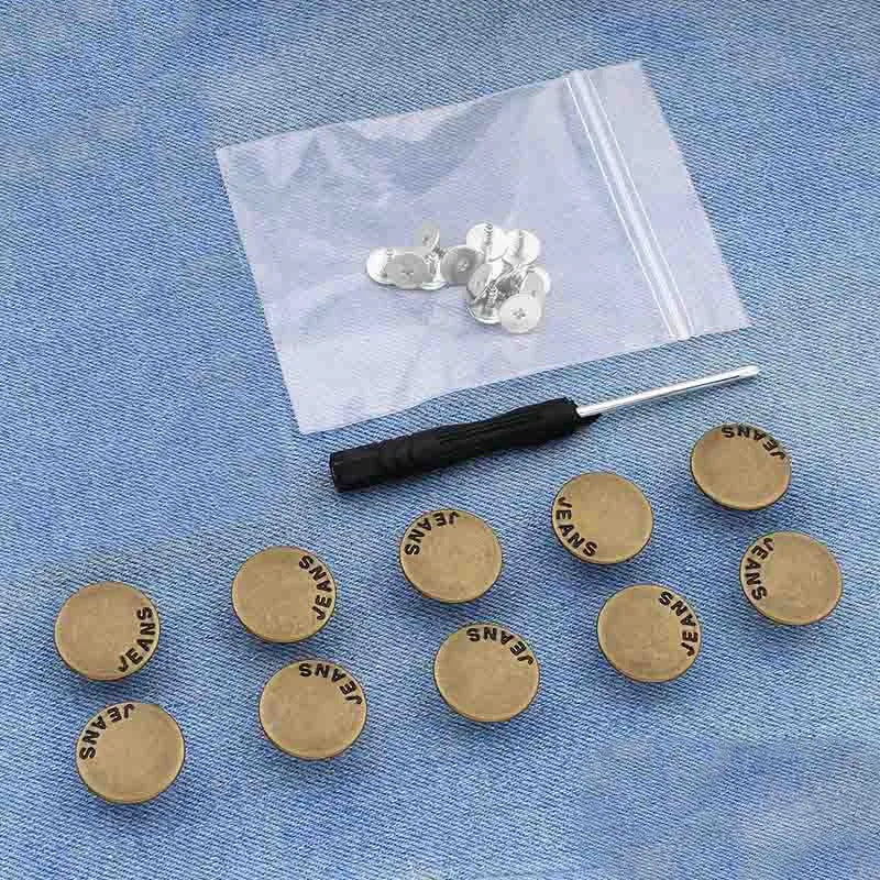 A set of durable metal button pins is displayed on a piece of white fabric.