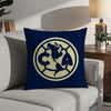 A navy blue decorative pillow featuring a gold-colored circular logo with the letters CA and a map outline of North America.