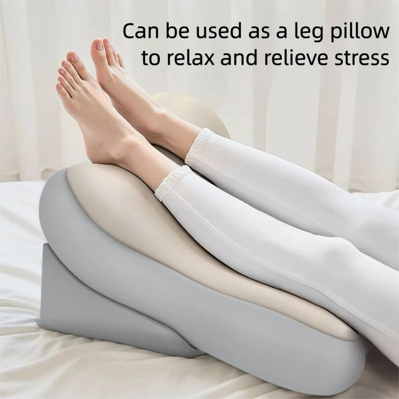 A pair of feet resting on a gray ergonomic memory foam pillow, suggesting relaxation and stress relief.