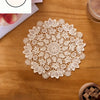 A white floral embroidered doily or placemat is centered on a wooden table, with a measuring line indicating 15cm/5.9inch.