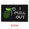 Black iron-on embroidered letter patch featuring a green pepper and the text I PULL OUT