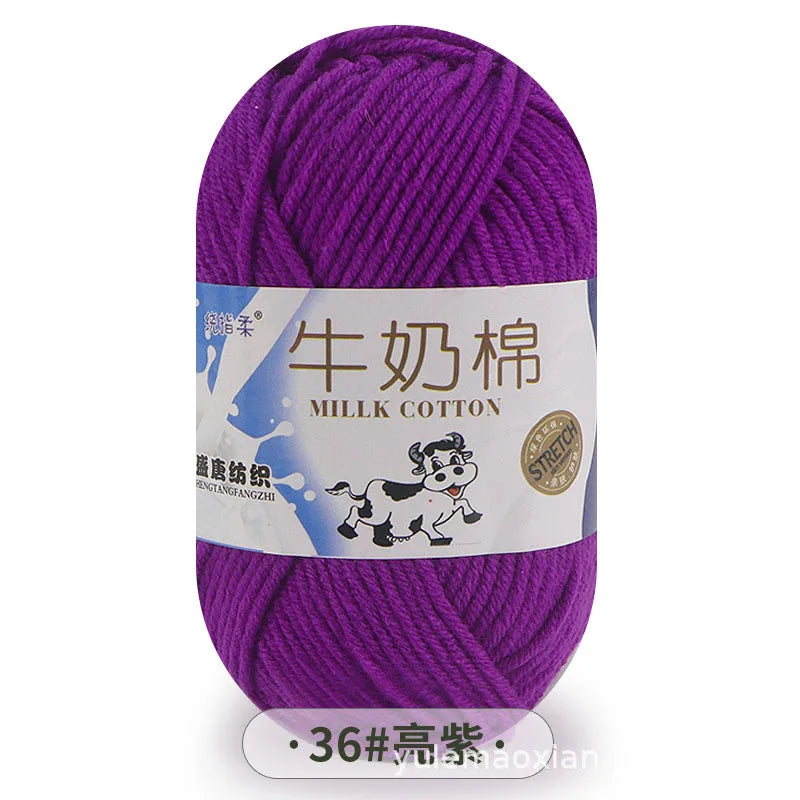 Purple milk cotton yarn skein with a label showing the name and thickness