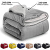 A collection of gray and colored sherpa fleece blankets shown in various folded forms.