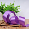 Roll of purple satin ribbon for gift wrapping and DIY crafts