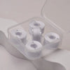 Clear plastic container holding several spools of prewound sewing machine bobbin threads