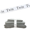 Gray bed sheets neatly folded and stacked with white organizer straps.