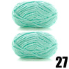A ball of thick, light mint green velvet yarn for knitting and crochet projects.