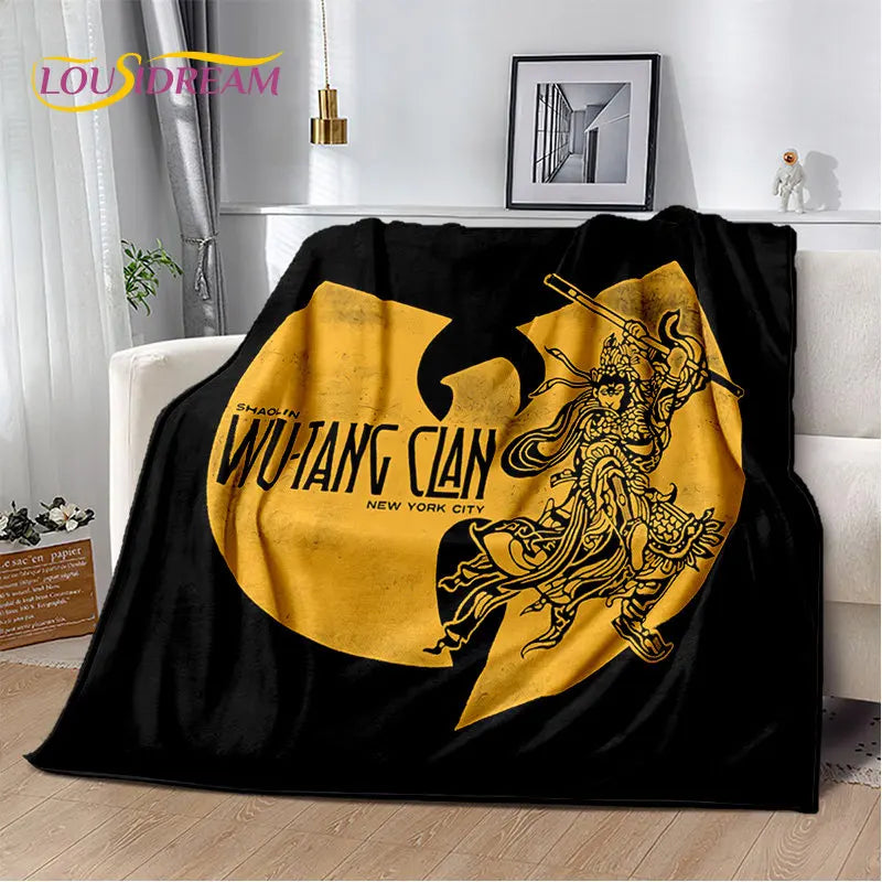 A black flannel throw blanket featuring a gold-colored graphic of a warrior in a dynamic pose.