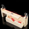 A wooden braiding frame with a box and red cord is shown for DIY bracelet making.