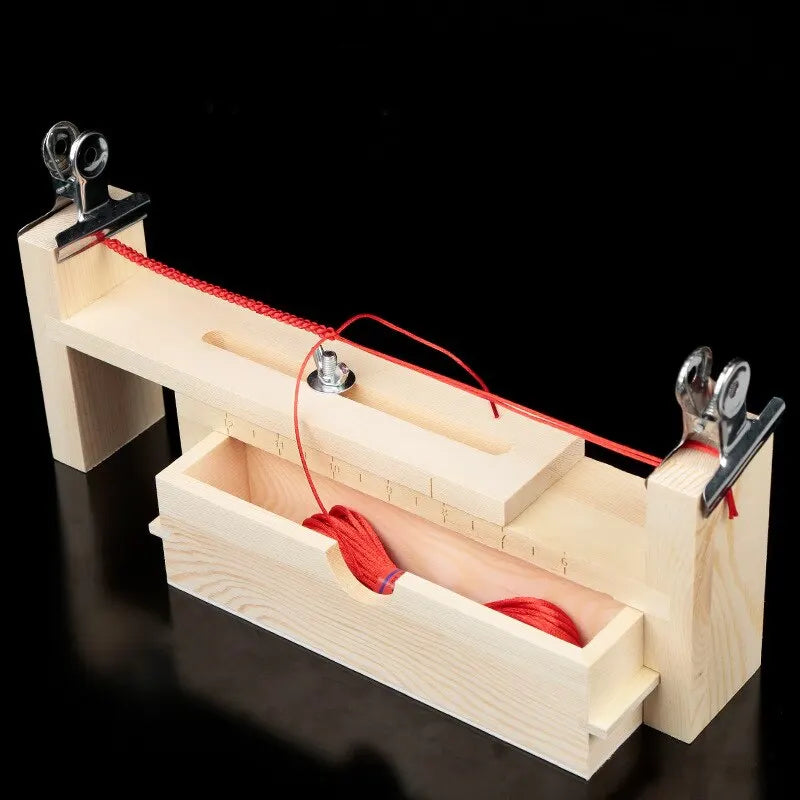 A wooden braiding frame with a box and red cord is shown for DIY bracelet making.