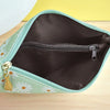 A light green coin purse made of PU leather with a zipper and a gold-colored wrist strap.