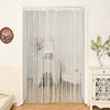 White beaded string curtains hanging in a doorway, used for home or party decor.