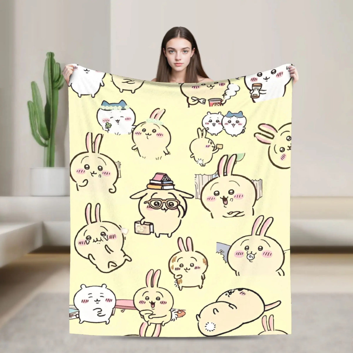 A yellow flannel throw blanket featuring a repeating pattern of cute Chiikawa cartoon characters.