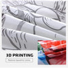 Rolls of white fabric with gray abstract stripes next to a swatch of red and blue floral fabric for 3D printing