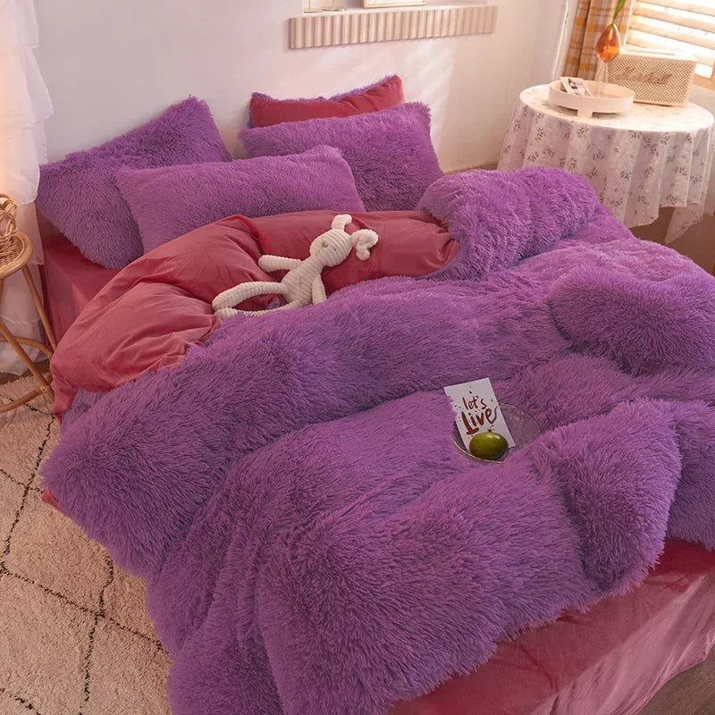 A purple plush mink velvet duvet set with pink accents and a white stuffed animal on a bed.
