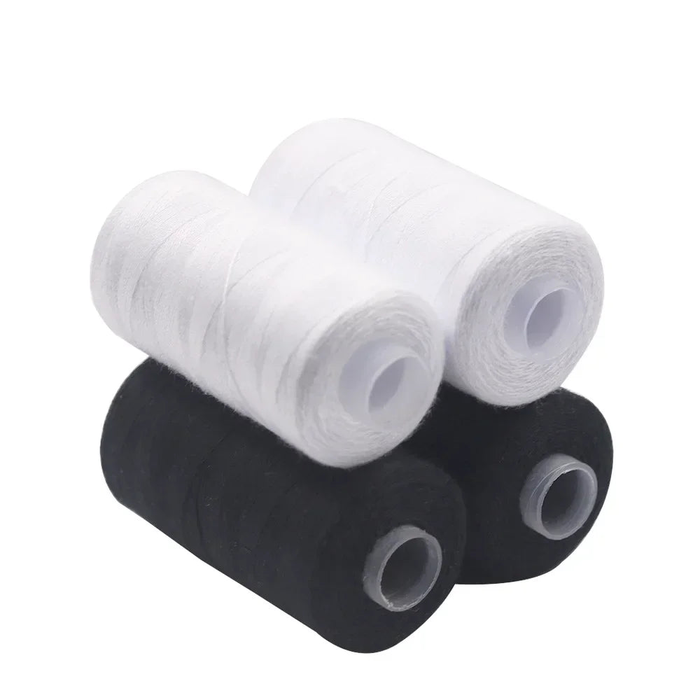A set of black and white heavy duty polyester sewing thread spools rolled on a white background.