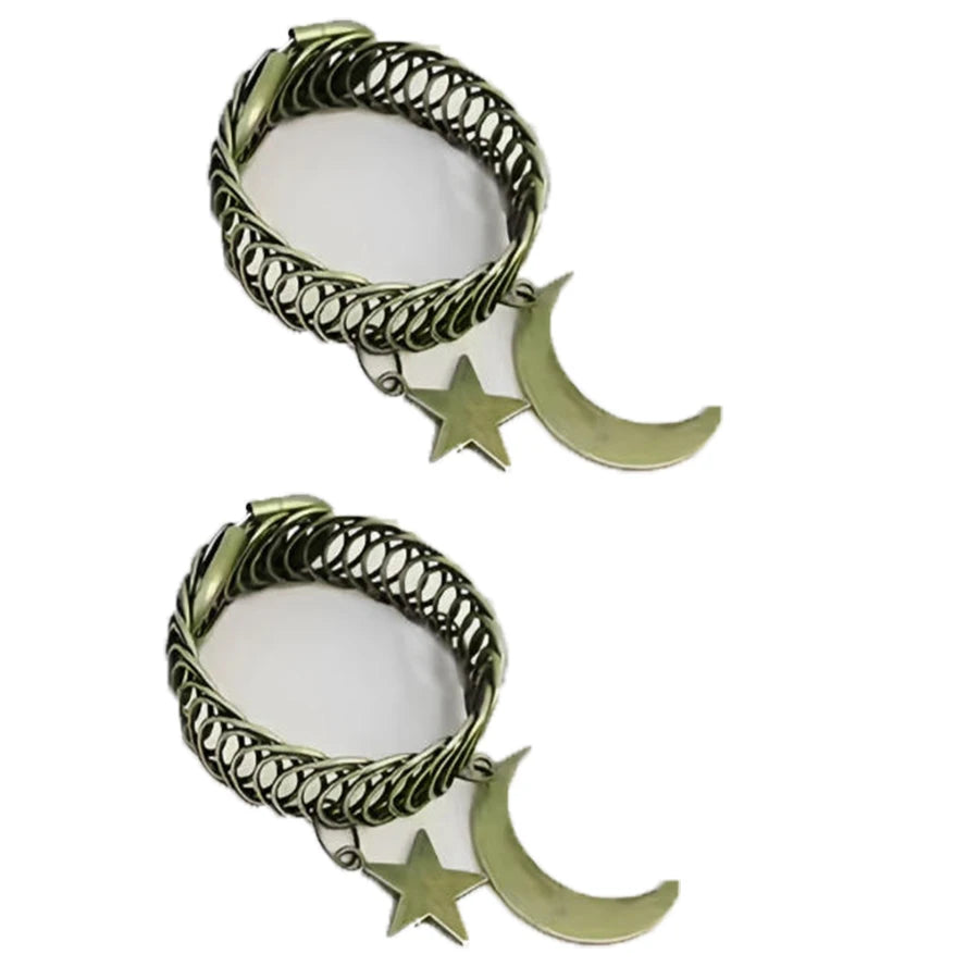 Vintage star and moon metal curtain clip featuring a twisted metal band and a crescent moon and star charm