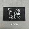 Black embroidered patch featuring a white outline of a cat with a paw print.