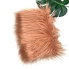 A fluffy, reddish-brown faux fur fabric used for sewing and crafting.