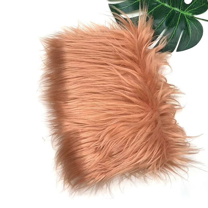 A fluffy, reddish-brown faux fur fabric used for sewing and crafting.
