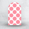 A vertical pink polka dot arch backdrop cover with a scalloped top, suitable for party decorations.