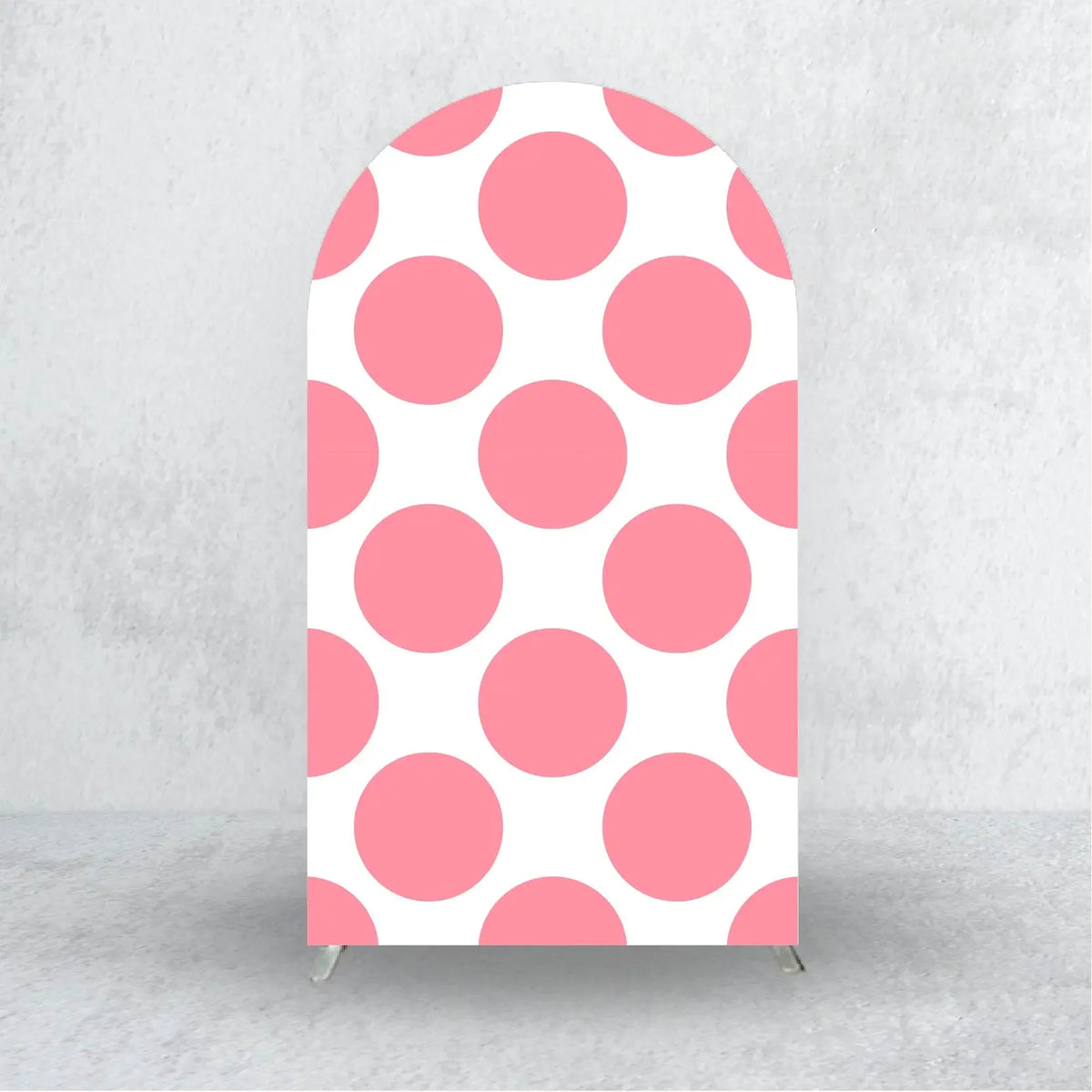 A vertical pink polka dot arch backdrop cover with a scalloped top, suitable for party decorations.