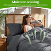 A woman is relaxing in a bed with a bamboo duvet cover, demonstrating moisture-wicking comfort.