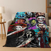 A colorful flannel throw blanket featuring various horror movie characters and monsters.