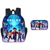 A black backpack with a Roblox theme featuring a glowing blue sphere and character graphics, paired with a matching pen case.