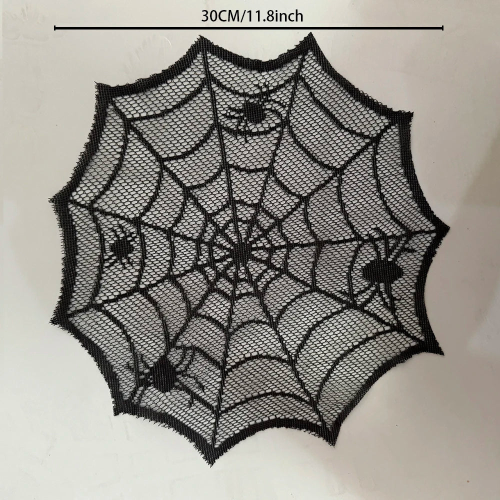 A black disposable table runner placemat featuring an intricate spider web design.