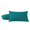 A pair of teal microfiber pillow covers lying flat.