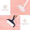 A cleaning tool is shown being used to clean a plush pink bedroom carpet.