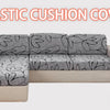 A light beige sofa covered with a gray elastic cushion cover featuring a black flower print.