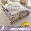 A washable quilt with a cartoon pattern featuring purple and green tones