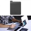 A dark gray adhesive laptop back storage pouch is shown next to a laptop.