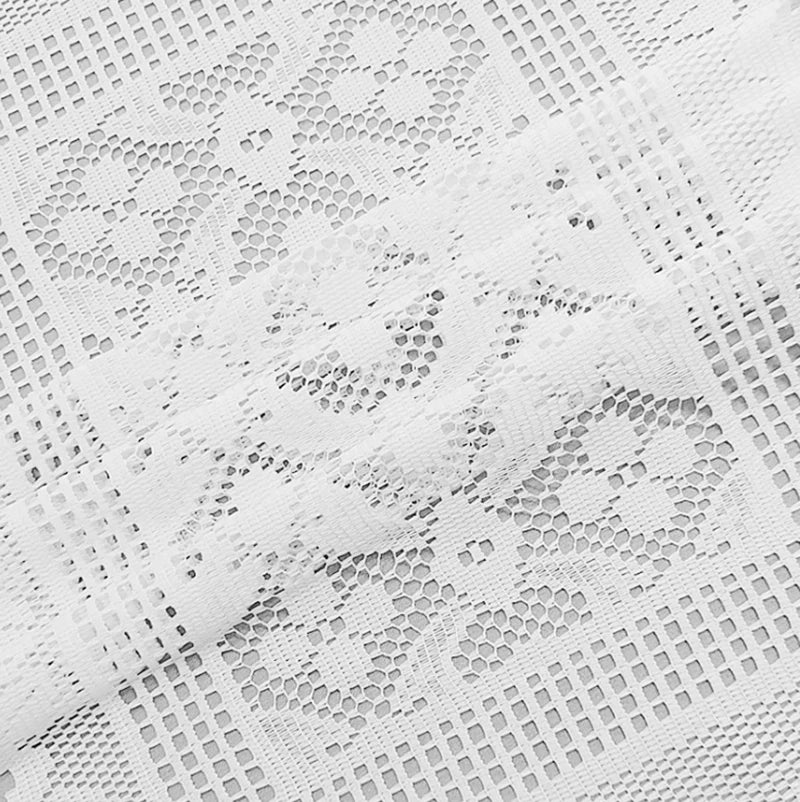White lace table runner with a delicate, repeating geometric pattern.