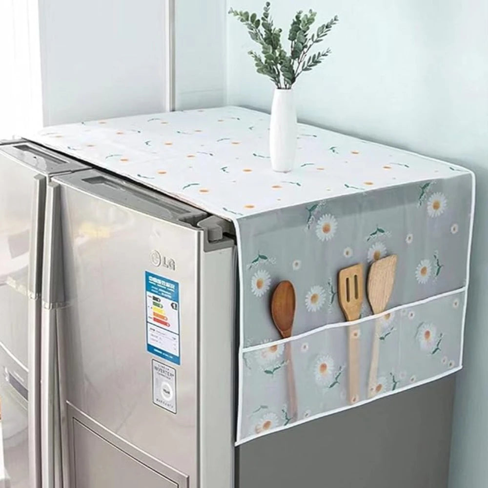 Reusable waterproof dust cover for refrigerator with a white vase of greenery on top