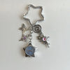 Silver star-shaped pocket watch keychain featuring an adjustable clock and a butterfly charm.