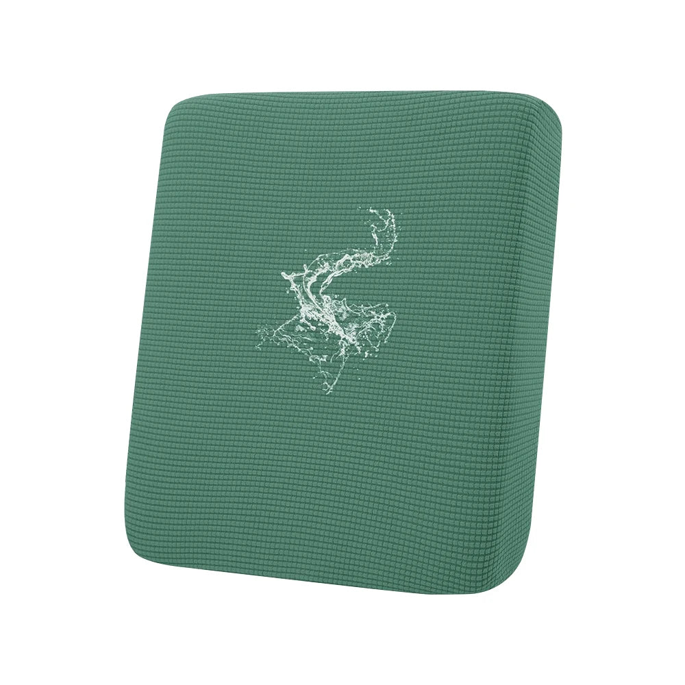 A dark green waterproof jacquard sofa seat slipcover with a white abstract design.
