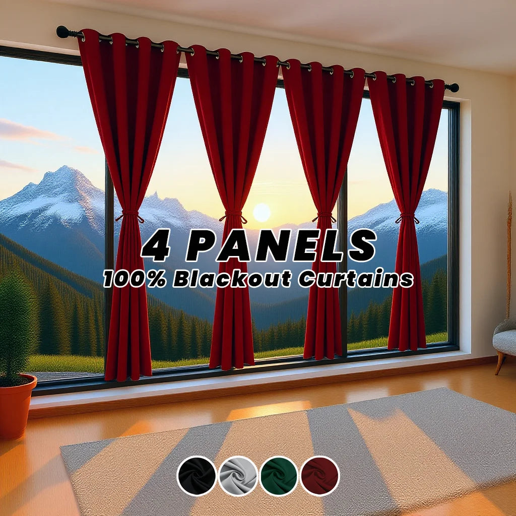 Four panels of red blackout curtains hanging in a window with a snowy mountain landscape view