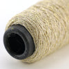 A roll of glitter metallic yarn used for crochet and knitting