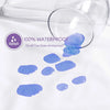 A clear glass lens shows blue watercolor paint on a white fabric, demonstrating the waterproof property of the pillow protect