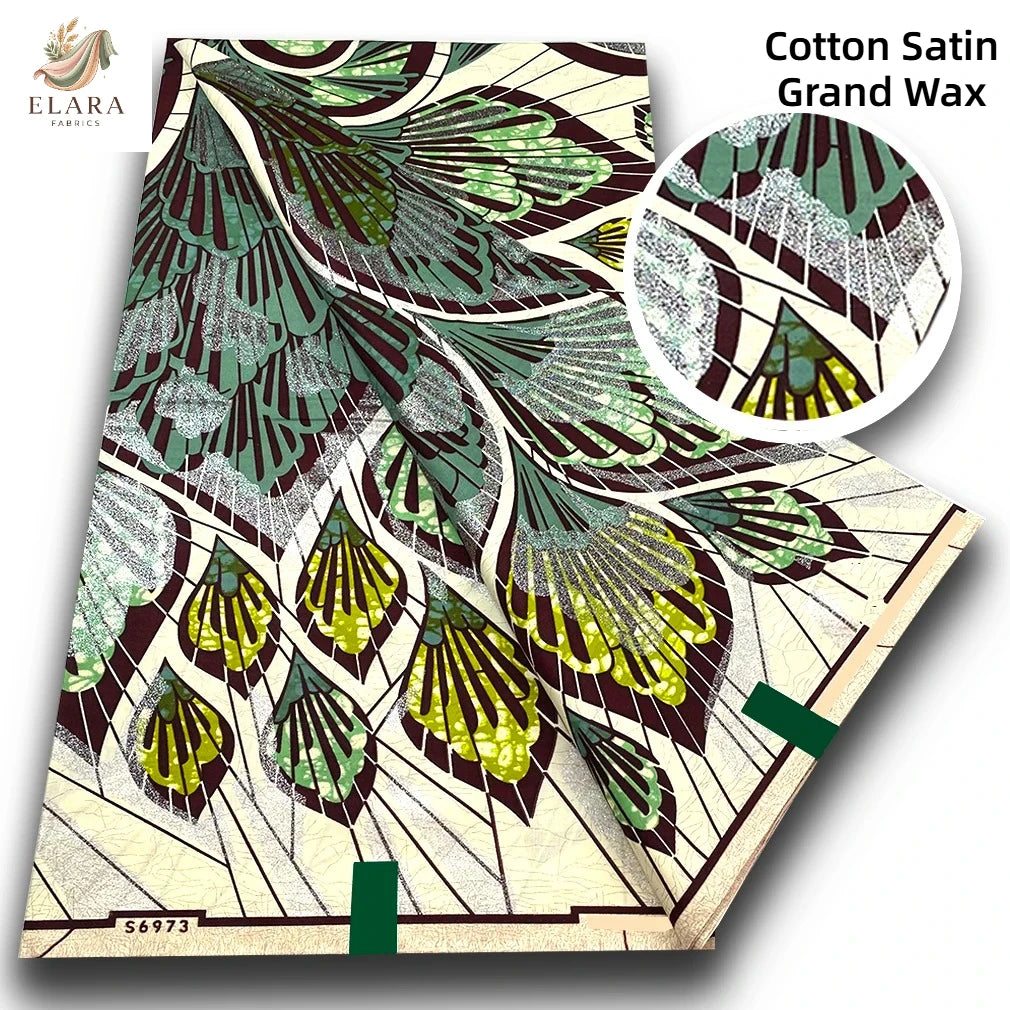 Cotton Satin Grand Wax fabric featuring a detailed green and brown leaf pattern.